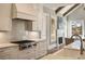 Chef's kitchen with stainless appliances and a large sink overlooking backyard at 3669 High Green Dr, Marietta, GA 30068