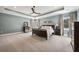 Spacious main bedroom with carpeted floors, trey ceilings, and neutral decor with views of the outdoors at 3669 High Green Dr, Marietta, GA 30068