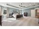 Spacious main bedroom with carpeted floors, trey ceilings, and neutral decor with views of the outdoors at 3669 High Green Dr, Marietta, GA 30068