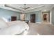 Expansive main bedroom featuring tray ceilings, carpeted floors, and access to a walk-in closet at 3669 High Green Dr, Marietta, GA 30068