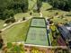 Beautifully maintained community tennis courts nestled next to a scenic golf course at 3669 High Green Dr, Marietta, GA 30068