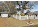Backyard with mature trees, offering shade and privacy at 8671 Lake Forrest Dr, Douglasville, GA 30134