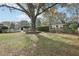 Backyard with mature trees, offering shade and privacy at 8671 Lake Forrest Dr, Douglasville, GA 30134