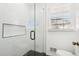 Shower with white subway tile and a glass door at 8671 Lake Forrest Dr, Douglasville, GA 30134
