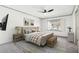 Cozy bedroom with neutral tones, comfortable bedding, and a ceiling fan at 8671 Lake Forrest Dr, Douglasville, GA 30134