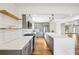 Contemporary kitchen with quartz countertops, stainless appliances and center island at 8671 Lake Forrest Dr, Douglasville, GA 30134