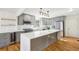 Modern kitchen featuring an island with quartz countertop, stainless steel appliances and sleek cabinetry at 8671 Lake Forrest Dr, Douglasville, GA 30134