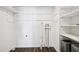 A laundry room with utility connections and shelving for organized storage at 8671 Lake Forrest Dr, Douglasville, GA 30134