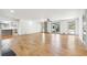 Spacious living room with hardwood floors, neutral walls and a decorative screen at 8671 Lake Forrest Dr, Douglasville, GA 30134