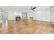 Open-concept living room with fireplace, built-ins, and hardwood flooring at 8671 Lake Forrest Dr, Douglasville, GA 30134