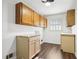 Mud room features overhead cabinets and vinyl flooring at 8671 Lake Forrest Dr, Douglasville, GA 30134
