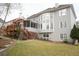 Exterior view of home with a deck and level backyard space at 1191 Crofton Landing, Suwanee, GA 30024