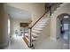 Entryway of home featuring stairs with wood and white trim and tile floors at 1191 Crofton Landing, Suwanee, GA 30024