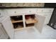 Open kitchen cabinets with slide out shelving for easy access and storage at 1191 Crofton Landing, Suwanee, GA 30024