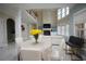 Open concept living room with fireplace and large windows at 1191 Crofton Landing, Suwanee, GA 30024