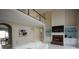Bright living room featuring a fireplace, built-in shelves, and a view of the loft at 1191 Crofton Landing, Suwanee, GA 30024