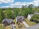 Picturesque aerial view of a residential neighborhood featuring well-maintained lawns and trees at 1191 Crofton Lndg, Suwanee, GA 30024