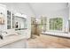 Lavish bathroom with double vanities, tub, and separate shower at 1191 Crofton Lndg, Suwanee, GA 30024