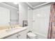Clean bathroom with white tile shower and tub, marble countertop, and modern fixtures at 1191 Crofton Lndg, Suwanee, GA 30024