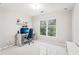 Bright bedroom with white tile floors, a large window, and a desk area at 1191 Crofton Lndg, Suwanee, GA 30024