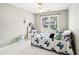 Cozy bedroom with white tile floors and large window at 1191 Crofton Lndg, Suwanee, GA 30024