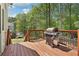 Enjoy outdoor cooking on this deck with gas grill and stairs to the lush backyard at 1191 Crofton Lndg, Suwanee, GA 30024