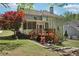 Beautiful home with backyard deck, mature trees, and lush green grass at 1191 Crofton Lndg, Suwanee, GA 30024
