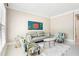 A cozy living room featuring a comfortable sofa, two accent chairs, and a decorative white rug at 1191 Crofton Lndg, Suwanee, GA 30024