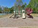 A fenced in playground with multiple slides is located near the community pool with ample space for fun and games at 1191 Crofton Lndg, Suwanee, GA 30024