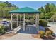 Poolside gazebo with table and chairs, perfect for a relaxing spot next to the pool at 1191 Crofton Lndg, Suwanee, GA 30024