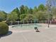 A splash pool provides fun on hot days with a small fenced in area, some chairs, and manicured landscaping at 1191 Crofton Lndg, Suwanee, GA 30024