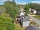Exterior photo of the back of the home with a screened in porch and manicured yard at 1191 Crofton Lndg, Suwanee, GA 30024