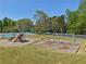 Neighborhood recreation area with a playground, a swing set, and a pool with many tables and chairs available at 1191 Crofton Lndg, Suwanee, GA 30024