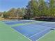Areal view of community tennis courts at Lansmoore Club, well-maintained and ready for a match at 1191 Crofton Lndg, Suwanee, GA 30024
