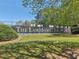 Lansmoore Club tennis courts with The Lansmoore Club sign shown on a sunny day at 1191 Crofton Lndg, Suwanee, GA 30024