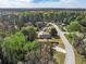 This aerial shows the property surrounded by lush greenery and is centrally located in a desirable area at 1857 Taffeta Trl, Lithonia, GA 30058
