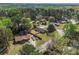This home boasts a large, fenced backyard, and the aerial view showcases its location near mature trees at 1857 Taffeta Trl, Lithonia, GA 30058
