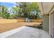 A concrete patio is near the house, and a new fence encloses the spacious backyard with a storage shed at 1857 Taffeta Trl, Lithonia, GA 30058
