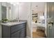 Bathroom features a granite counter, modern fixtures, and an adjoining bedroom, offering comfort and style at 1857 Taffeta Trl, Lithonia, GA 30058