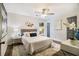 Inviting bedroom showcasing hardwood floors, a cozy queen bed, and modern decor at 1857 Taffeta Trl, Lithonia, GA 30058