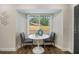 Bright breakfast nook with a view of the outdoors and modern furnishings at 1857 Taffeta Trl, Lithonia, GA 30058