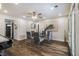 Elegant dining room with a glass-top table, stylish chairs, and lots of natural light at 1857 Taffeta Trl, Lithonia, GA 30058