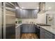 Updated kitchen featuring stainless steel appliances and stylish gray cabinetry at 1857 Taffeta Trl, Lithonia, GA 30058