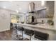 Modern kitchen featuring granite countertops, stainless steel appliances, and breakfast bar seating at 1857 Taffeta Trl, Lithonia, GA 30058