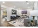 Bright and modern living room featuring stylish furniture and contemporary decor at 1857 Taffeta Trl, Lithonia, GA 30058