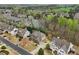 Aerial view of a home in a well-maintained neighborhood with mature trees and landscaping at 1870 Marcia Overlook Dr, Cumming, GA 30041
