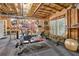 Basement gym featuring various equipment, exposed framing, and open ceilings for a functional workout space at 1870 Marcia Overlook Dr, Cumming, GA 30041