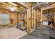 View of the unfinished basement featuring gym equipment, exposed framing, and open ceilings at 1870 Marcia Overlook Dr, Cumming, GA 30041
