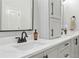 Bright bathroom featuring double sinks, white countertops, and modern fixtures, offering a clean and stylish space at 1870 Marcia Overlook Dr, Cumming, GA 30041