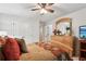 Comfortable bedroom with a fan, shuttered windows, and a dresser, offering a peaceful retreat at 1870 Marcia Overlook Dr, Cumming, GA 30041